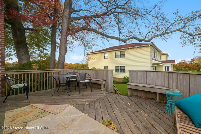 a view of a wooden chairs and table on the wooden floor