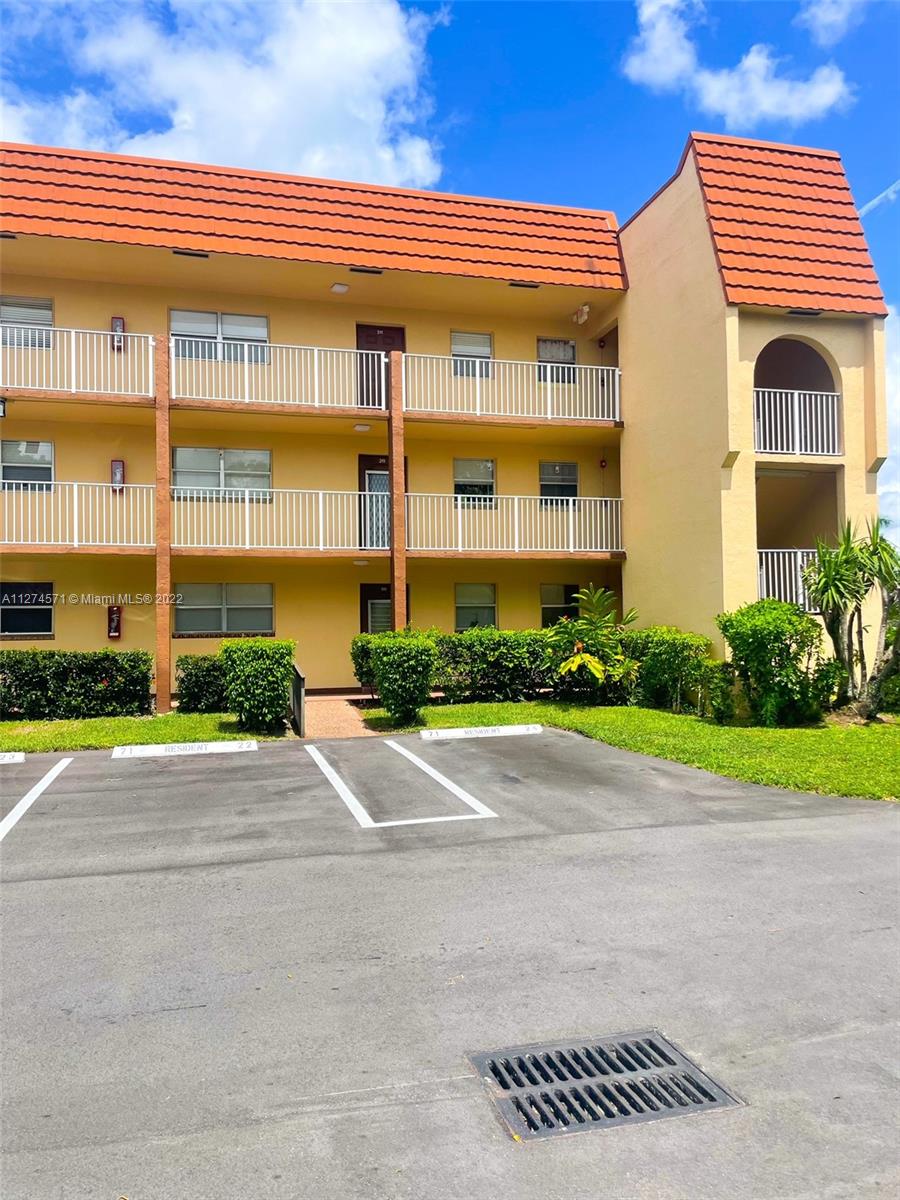 2811 North Pine Island Road, Unit 111 Sunrise, FL 33322 - Photo 1 of 16 a front view of a building