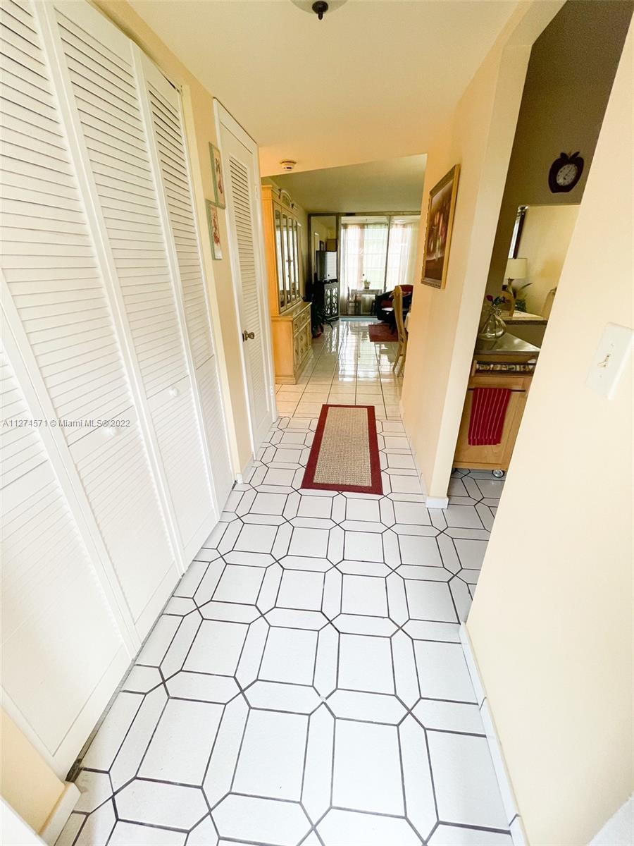 2811 North Pine Island Road, Unit 111 Sunrise, FL 33322 - Photo 3 of 16 a view of a entryway door of the house