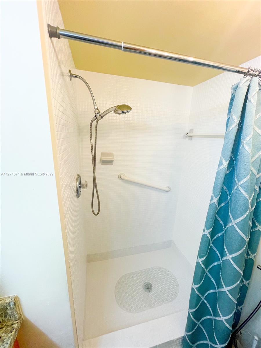 2811 North Pine Island Road, Unit 111 Sunrise, FL 33322 - Photo 8 of 16 a bathroom with a shower