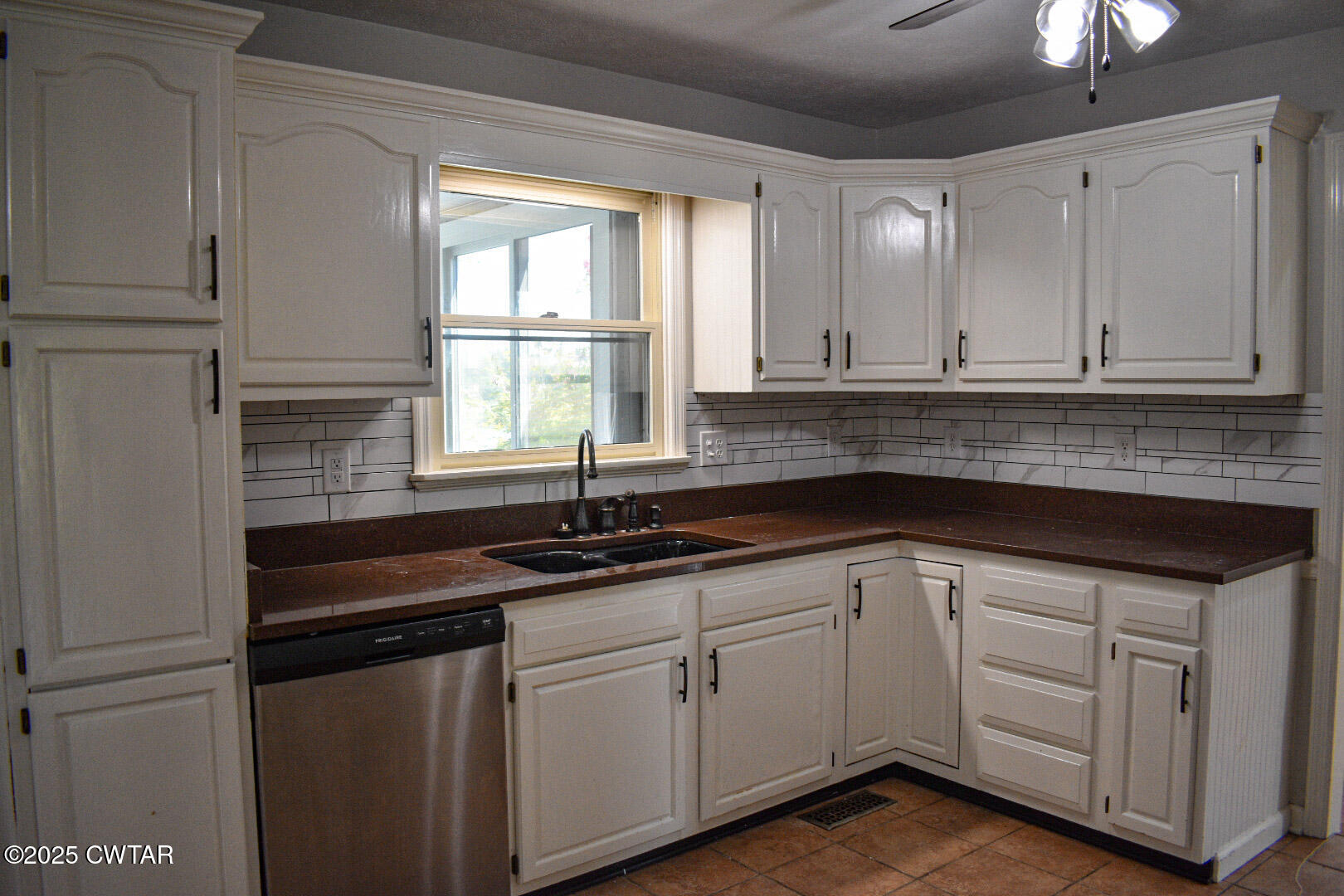 612 Wynridge Troy, TN 38260 - Photo 12 of 42 a kitchen with white cabinets and sink