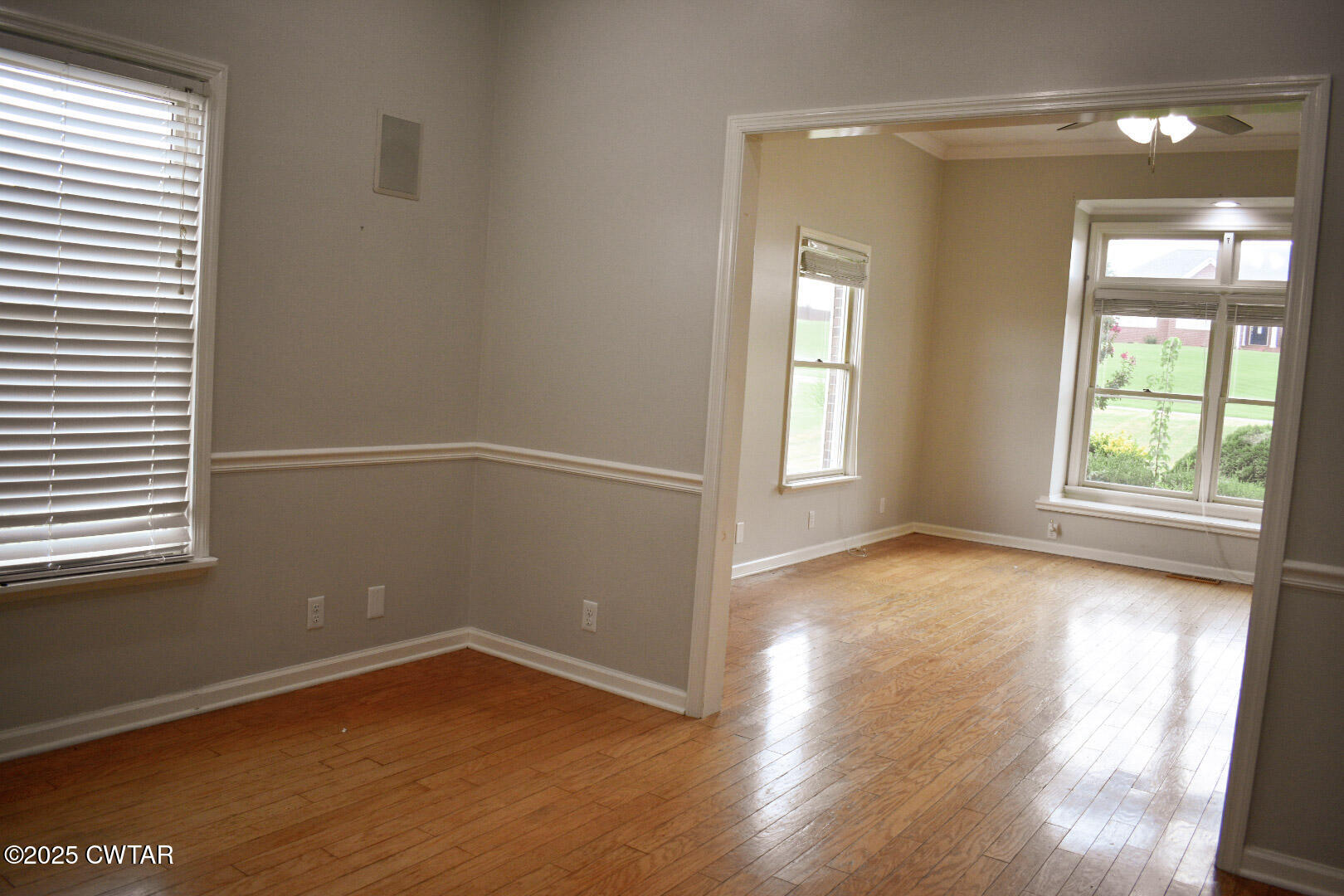 612 Wynridge Troy, TN 38260 - Photo 22 of 42 an empty room with wooden floor and windows