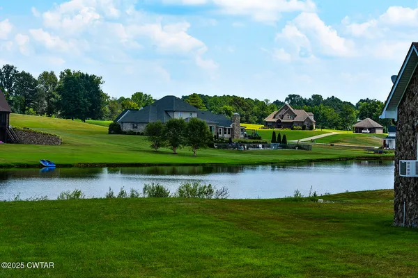 a view of a lake with a house in the background