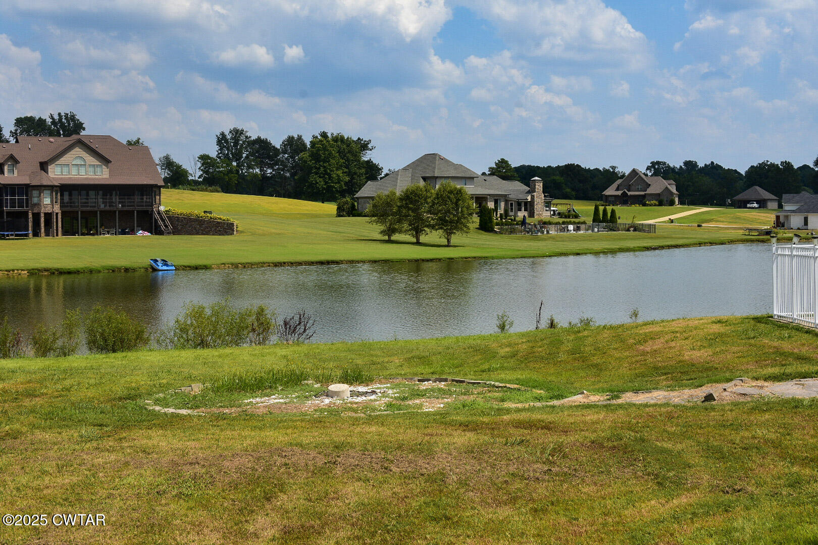 612 Wynridge Troy, TN 38260 - Photo 39 of 42 a view of a lake with houses in the background