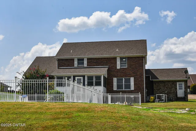 a front view of the house with a yard
