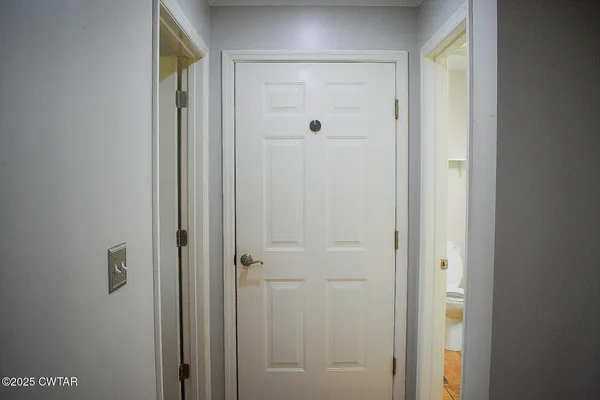 a bathroom with a glass shower door