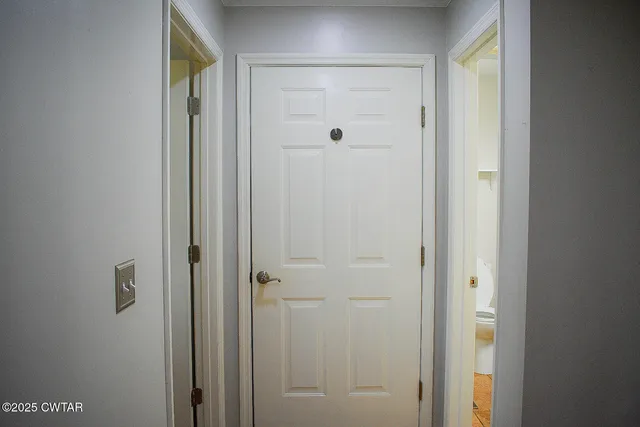 a bathroom with a glass shower door