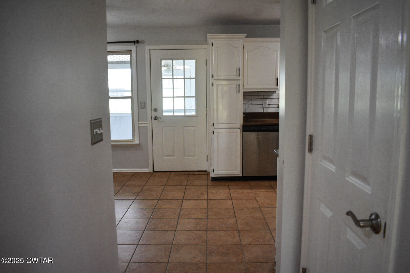 612 Wynridge Troy, TN 38260 - Photo 10 of 42 a view of a kitchen with an empty space and a window
