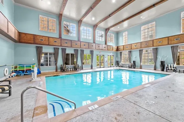 a view of swimming pool with outdoor seating