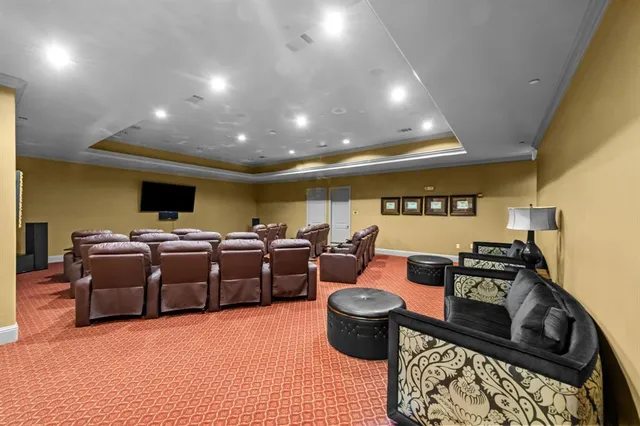 a living room with lots of furniture and clutter