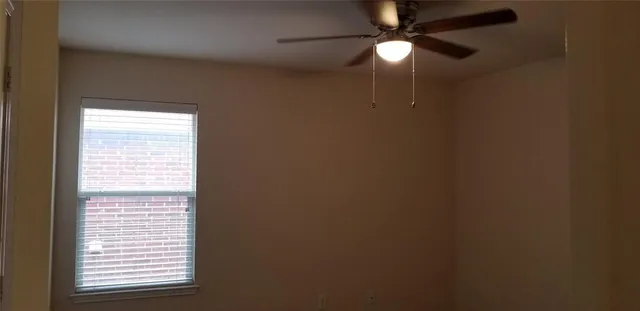 a lamp on a chandelier fan and window