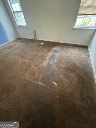 an empty room with windows