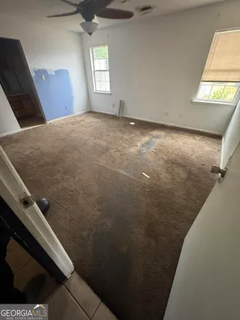 a view of an empty room and window