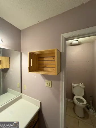 a bathroom with a toilet and a sink