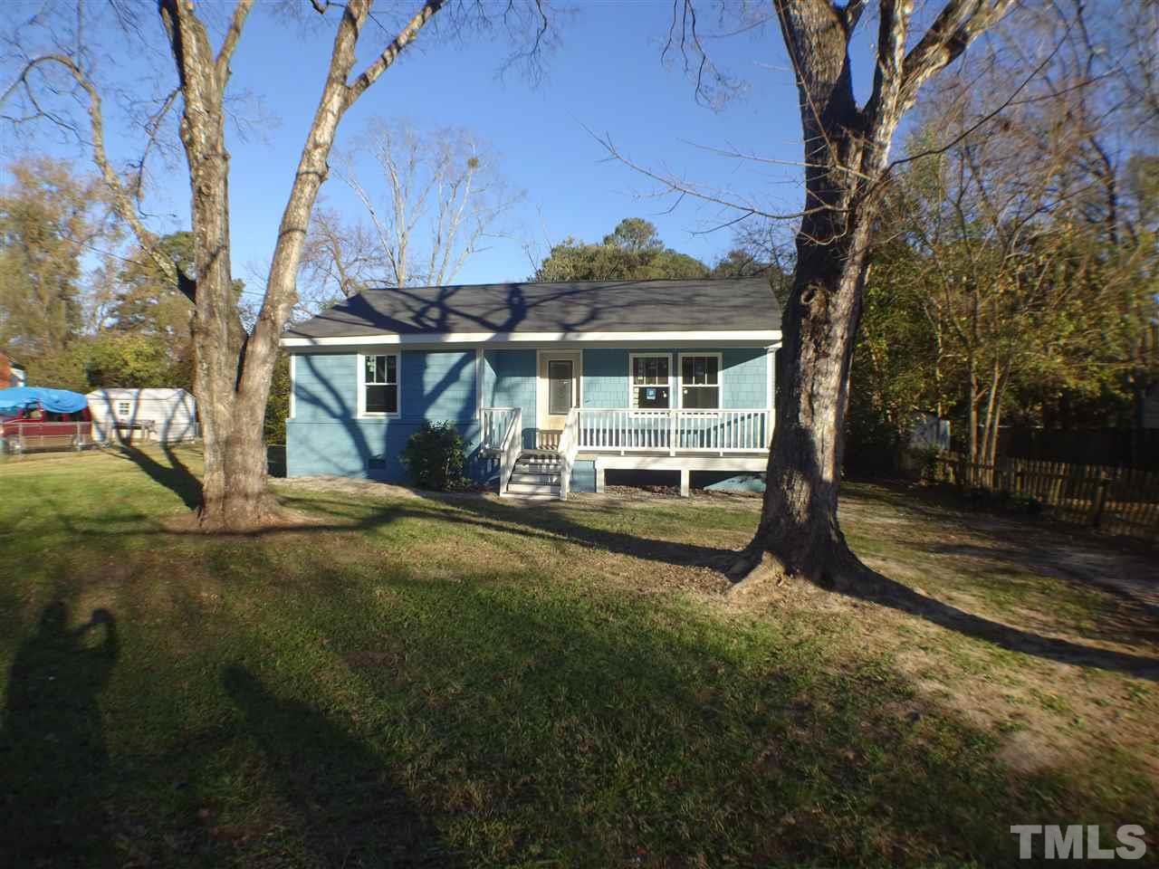 427 Lamont Street Raleigh, NC 27610 - Photo 2 of 13 a view of a house with backyard and a tree