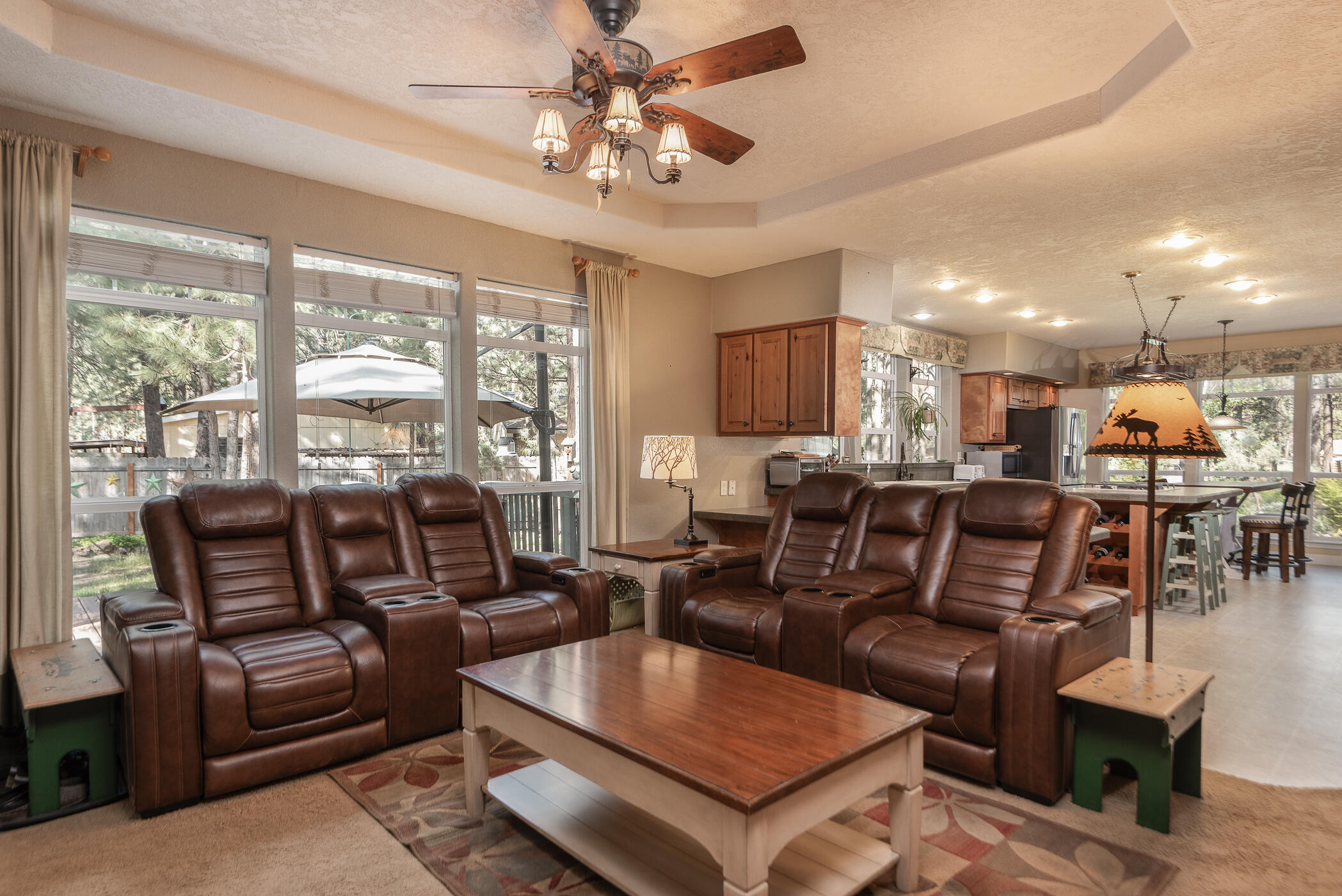 60055 Hopi Road Bend, OR 97702 - Photo 15 of 37 a living room with furniture kitchen view and a large window