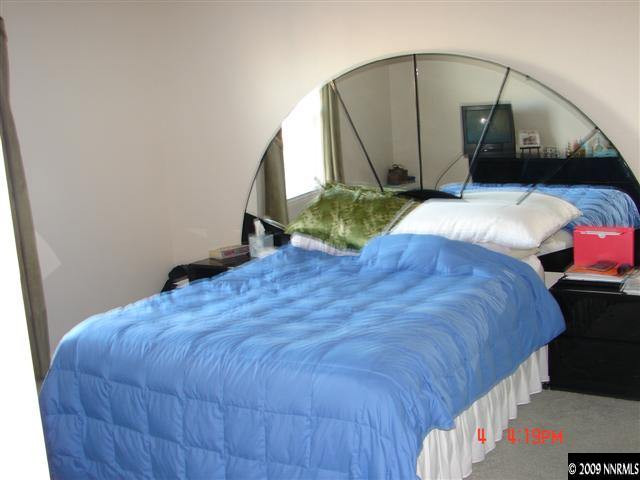 2904 Bryan Street Reno, NV 89503 - Photo 3 of 8 a bed sitting in a bedroom next to a window