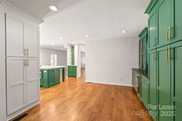 a view of a hallway with a kitchen