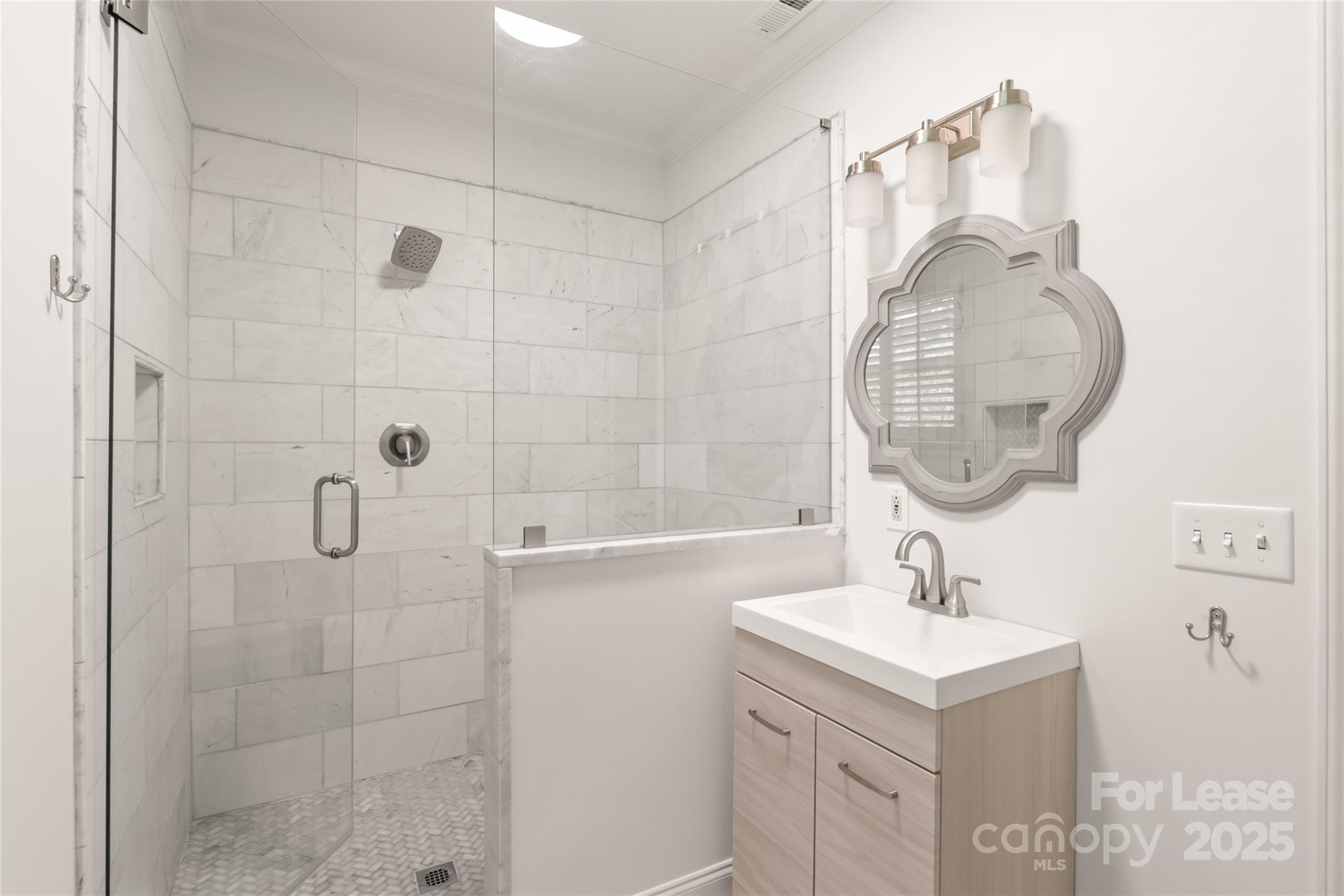 3726 Providence Road Charlotte, NC 28211 - Photo 22 of 45 a bathroom with a sink a mirror and shower