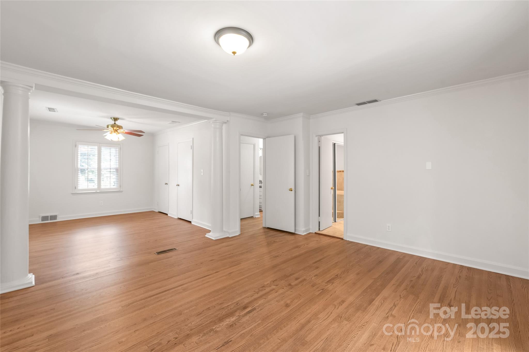 3726 Providence Road Charlotte, NC 28211 - Photo 24 of 45 an empty room with wooden floor and windows