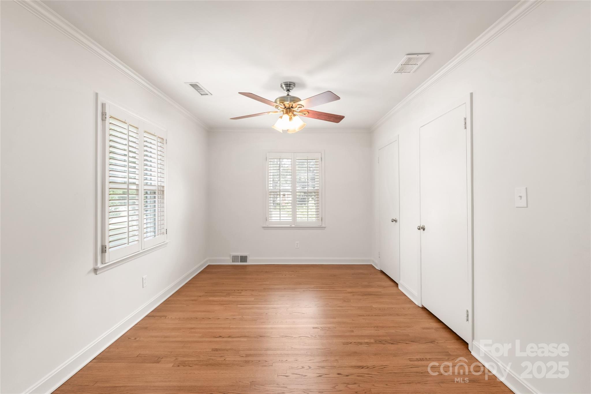 3726 Providence Road Charlotte, NC 28211 - Photo 25 of 45 a view of an empty room with a window and a ceiling fan