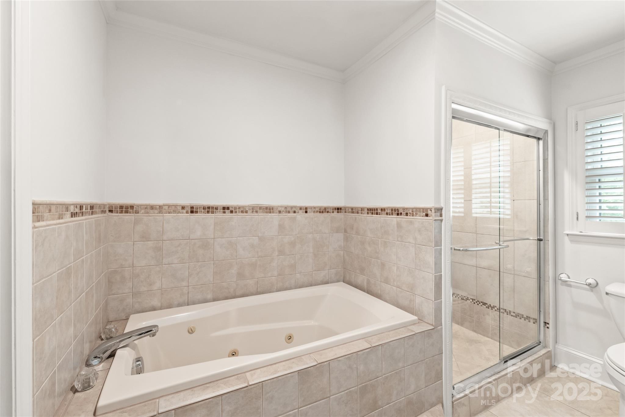 3726 Providence Road Charlotte, NC 28211 - Photo 26 of 45 a bathroom with a bathtub