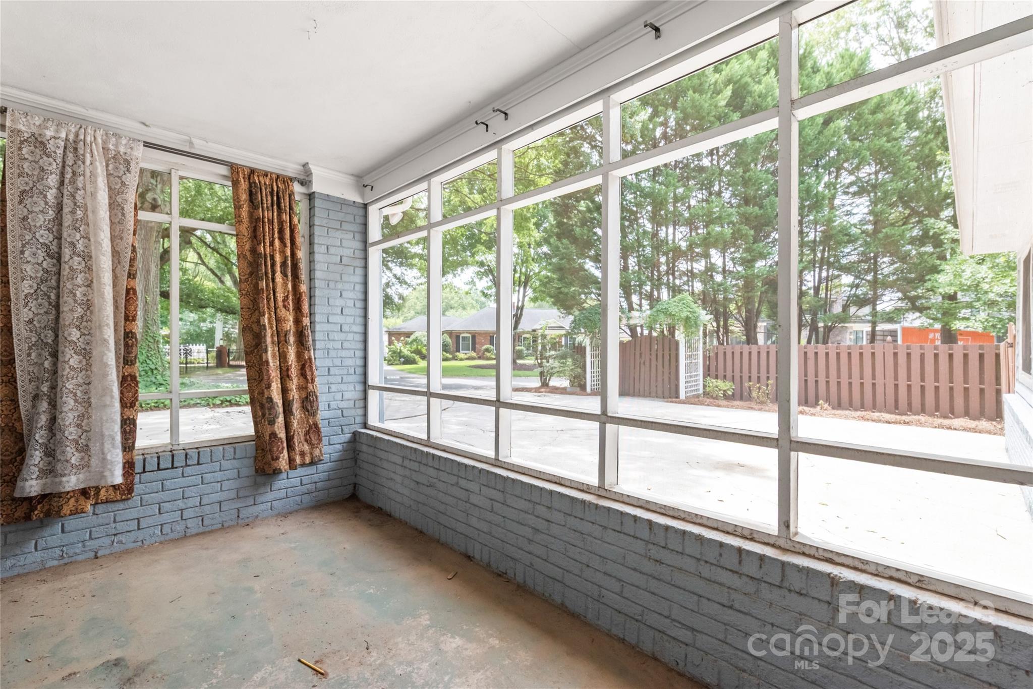 3726 Providence Road Charlotte, NC 28211 - Photo 31 of 45 a view of an empty room with wooden floor and a window