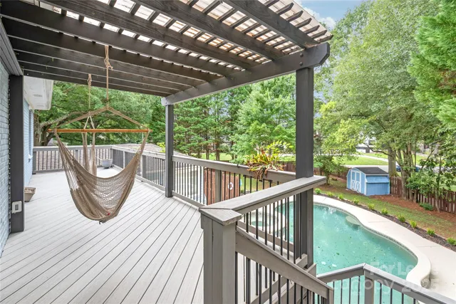 a view of a chairs and table in the balcony
