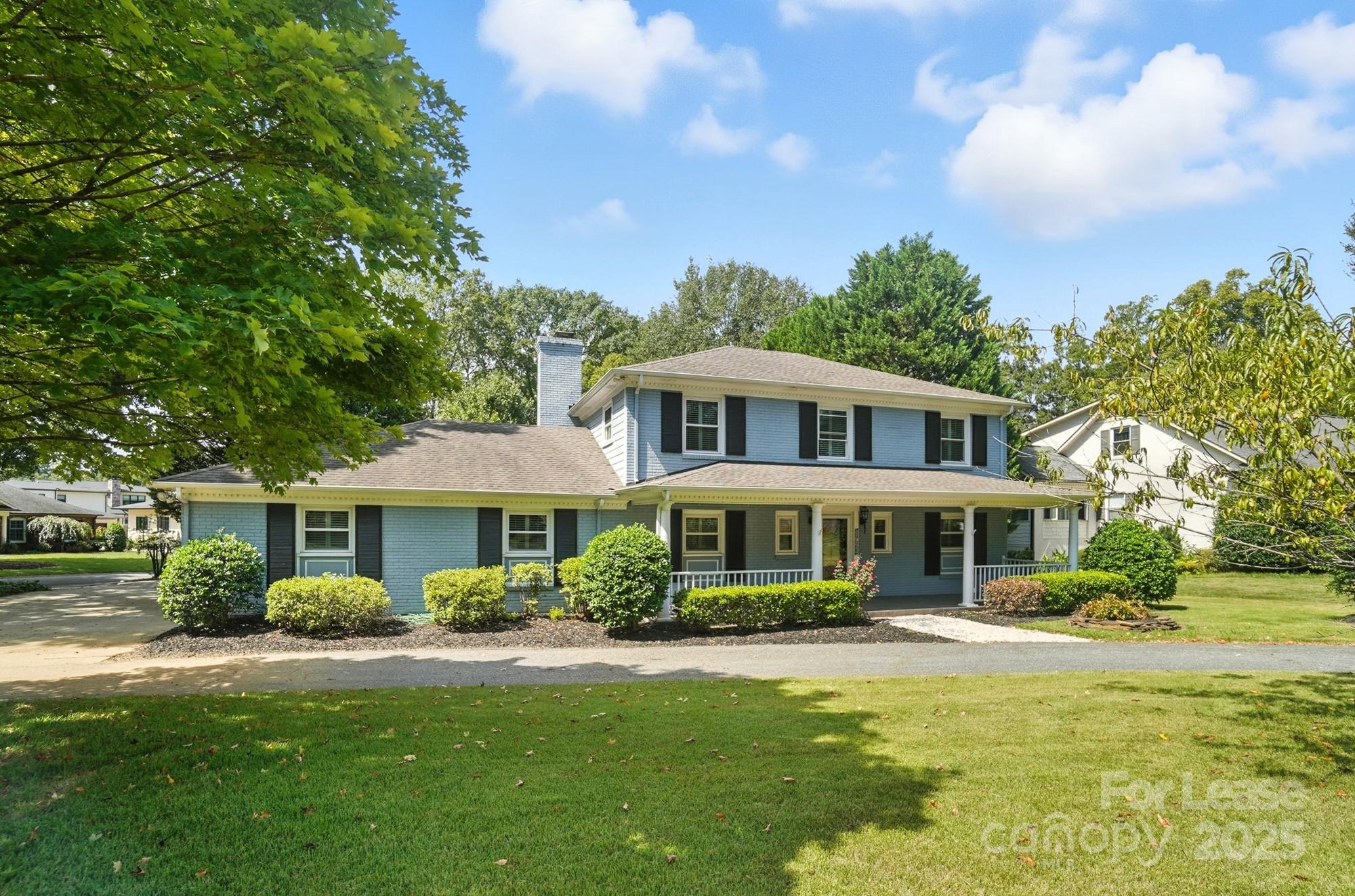3726 Providence Road Charlotte, NC 28211 - Photo 43 of 45 a front view of a house with a yard table and chairs