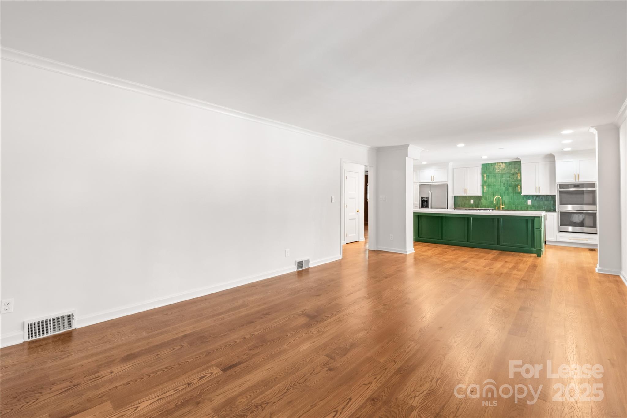 3726 Providence Road Charlotte, NC 28211 - Photo 9 of 45 a view of a room with wooden floor and windows