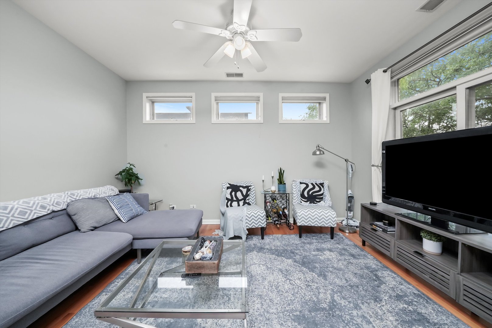 1535 West Ohio Street, Unit 2 Chicago, IL 60642 - Photo 14 of 25 a living room with furniture and a flat screen tv