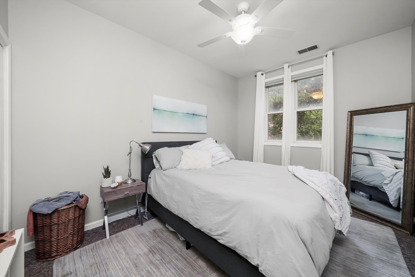 1535 West Ohio Street, Unit 2 Chicago, IL 60642 - Photo 19 of 25 a bedroom with a bed and wooden floor