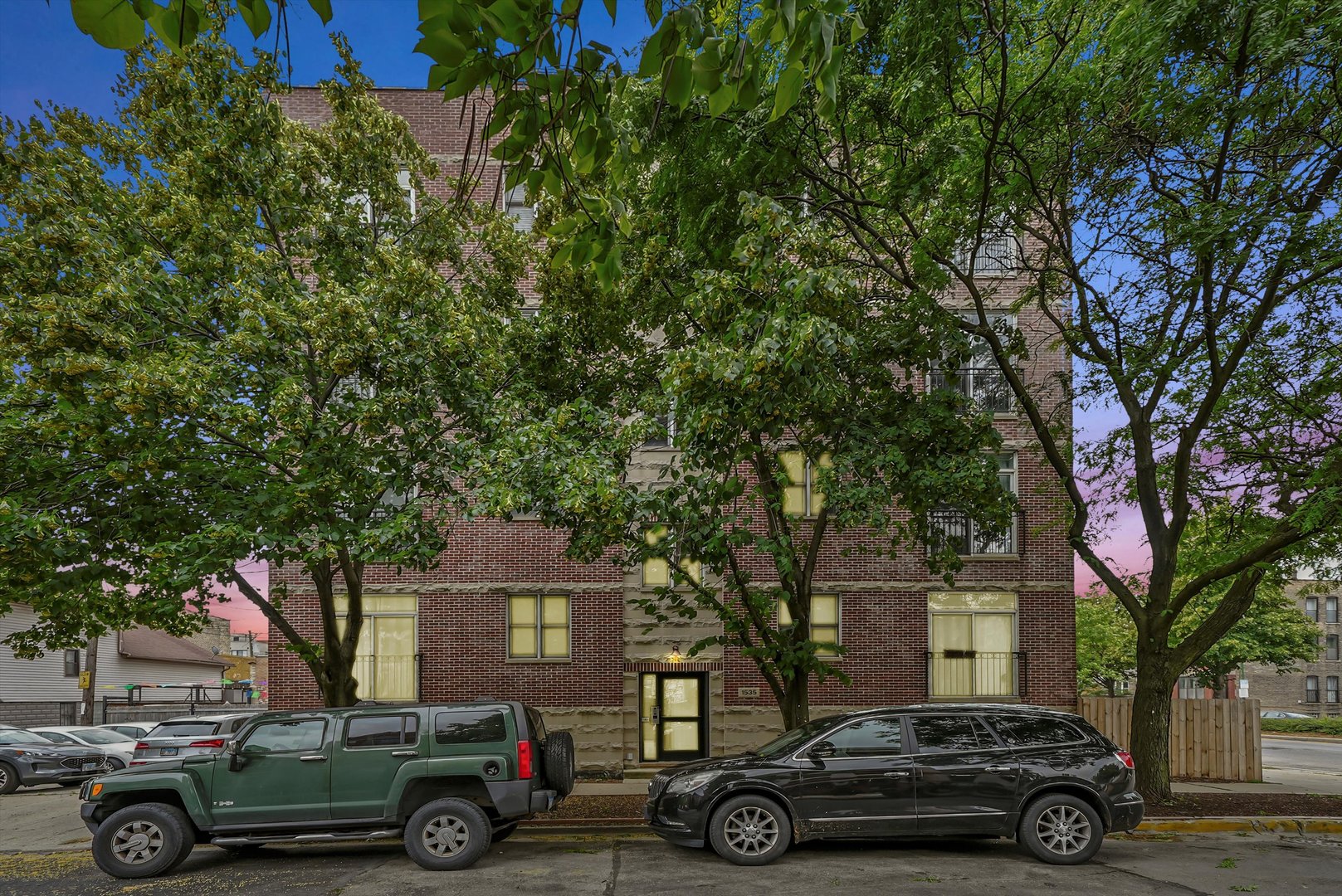 1535 West Ohio Street, Unit 2 Chicago, IL 60642 - Photo 2 of 25 a car parked in front of a house
