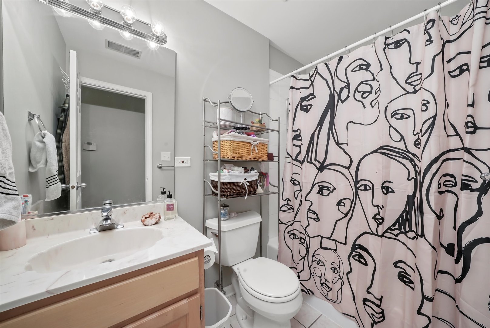 1535 West Ohio Street, Unit 2 Chicago, IL 60642 - Photo 21 of 25 a bathroom with a toilet sink and mirror