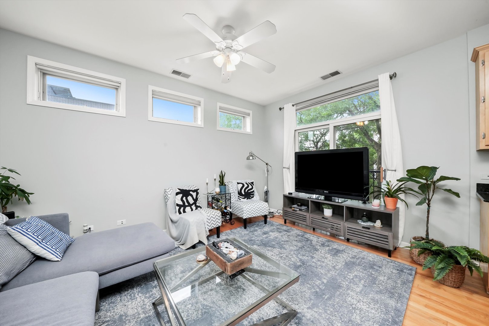 1535 West Ohio Street, Unit 2 Chicago, IL 60642 - Photo 5 of 25 a living room with furniture and a flat screen tv