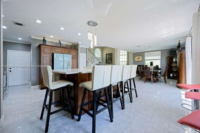 9770 Scribner Lane Wellington, FL 33414 - Photo 11 of 43 a view of a dining room with furniture