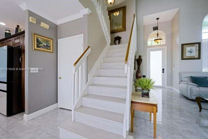 9770 Scribner Lane Wellington, FL 33414 - Photo 12 of 43 a view of entryway and hall with wooden floor