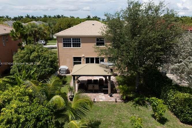 9770 Scribner Lane Wellington, FL 33414 - Photo 21 of 43 an aerial view of a house with a yard