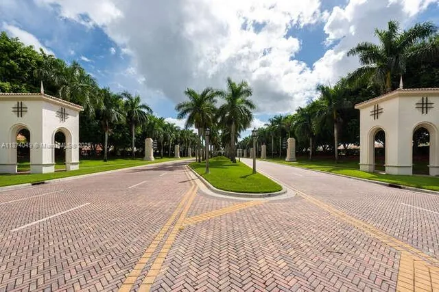 a view of a white house with a yard