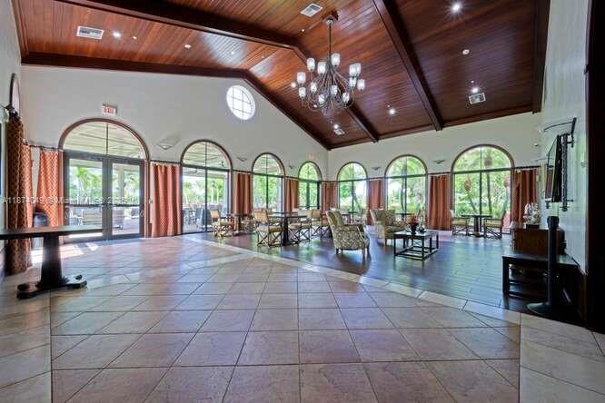 9770 Scribner Lane Wellington, FL 33414 - Photo 33 of 43 a lobby with furniture and chandelier