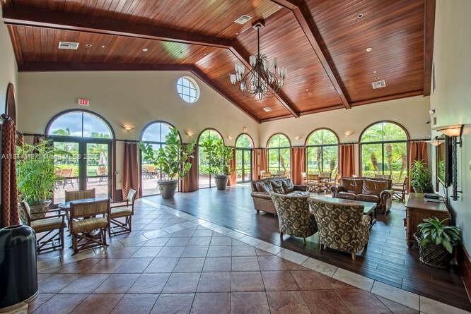 9770 Scribner Lane Wellington, FL 33414 - Photo 35 of 43 a view of living room filled with furniture and chandelier
