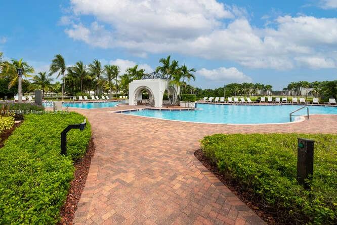 9770 Scribner Lane Wellington, FL 33414 - Photo 39 of 43 a view of a lake with a garden