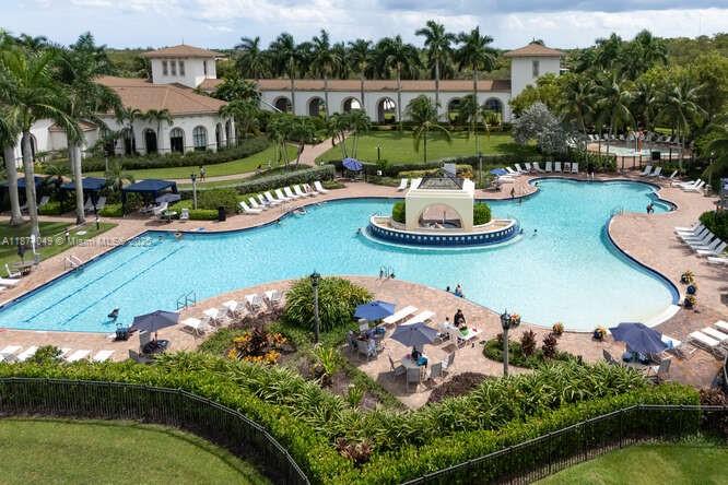9770 Scribner Lane Wellington, FL 33414 - Photo 41 of 43 an aerial view of a house with a garden and lake view