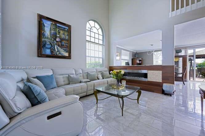 9770 Scribner Lane Wellington, FL 33414 - Photo 6 of 43 a living room with furniture and a large window