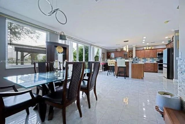 a dining room with furniture and window