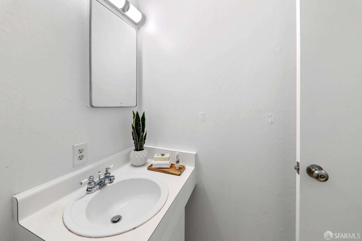 20 Point Reyes Way Pacifica, CA 94044 - Photo 23 of 78 a bathroom with a sink and a mirror
