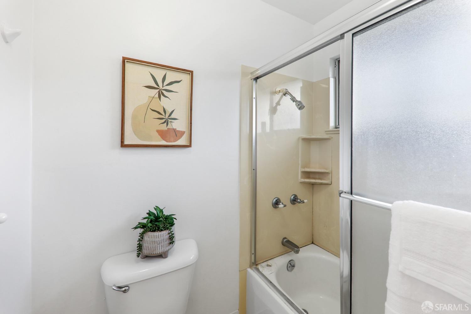 20 Point Reyes Way Pacifica, CA 94044 - Photo 27 of 78 a bathroom with a tub shower and toilet