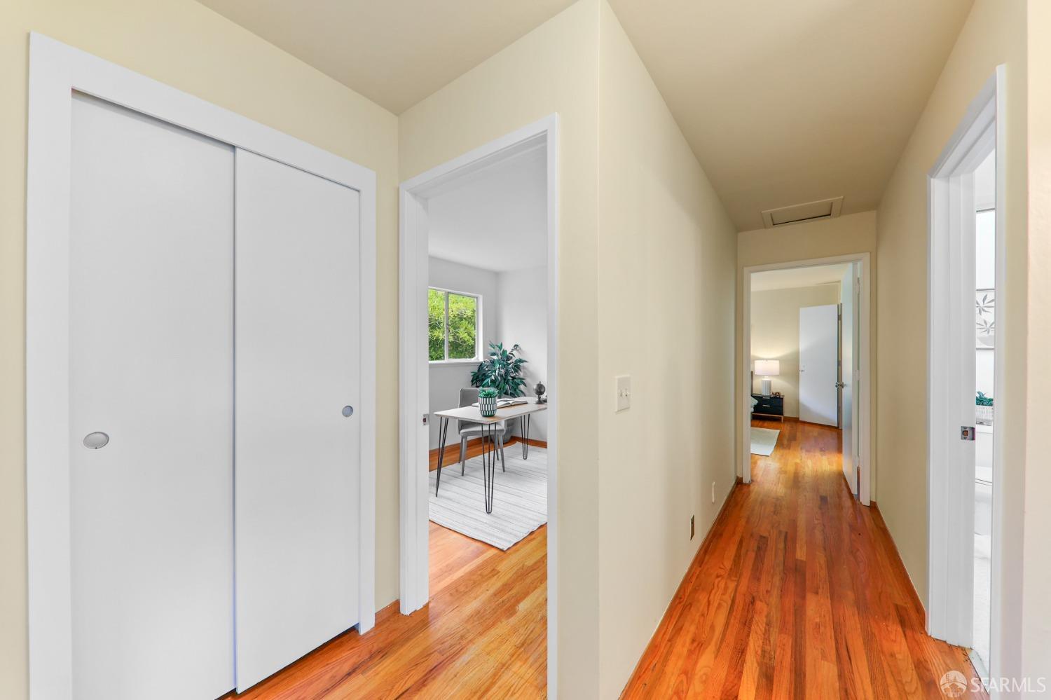 20 Point Reyes Way Pacifica, CA 94044 - Photo 41 of 78 a view of a hallway with wooden floor and furniture
