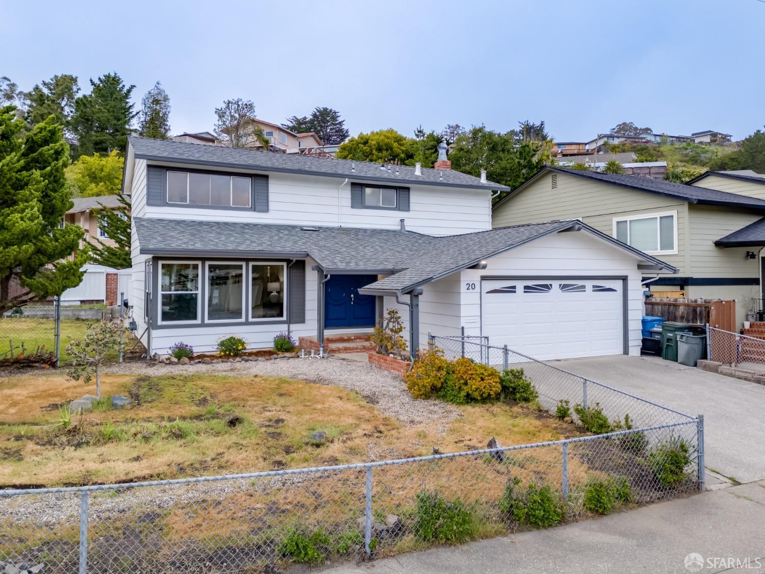 20 Point Reyes Way Pacifica, CA 94044 - Photo 64 of 78 a front view of a house with a yard and potted plants