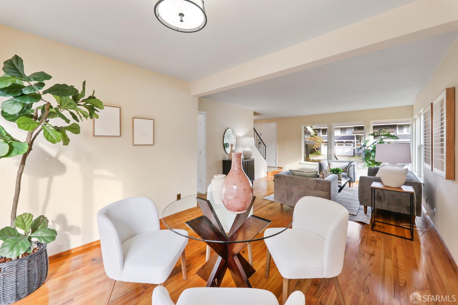 20 Point Reyes Way Pacifica, CA 94044 - Photo 7 of 78 a dining room with furniture a potted plant and wooden floor
